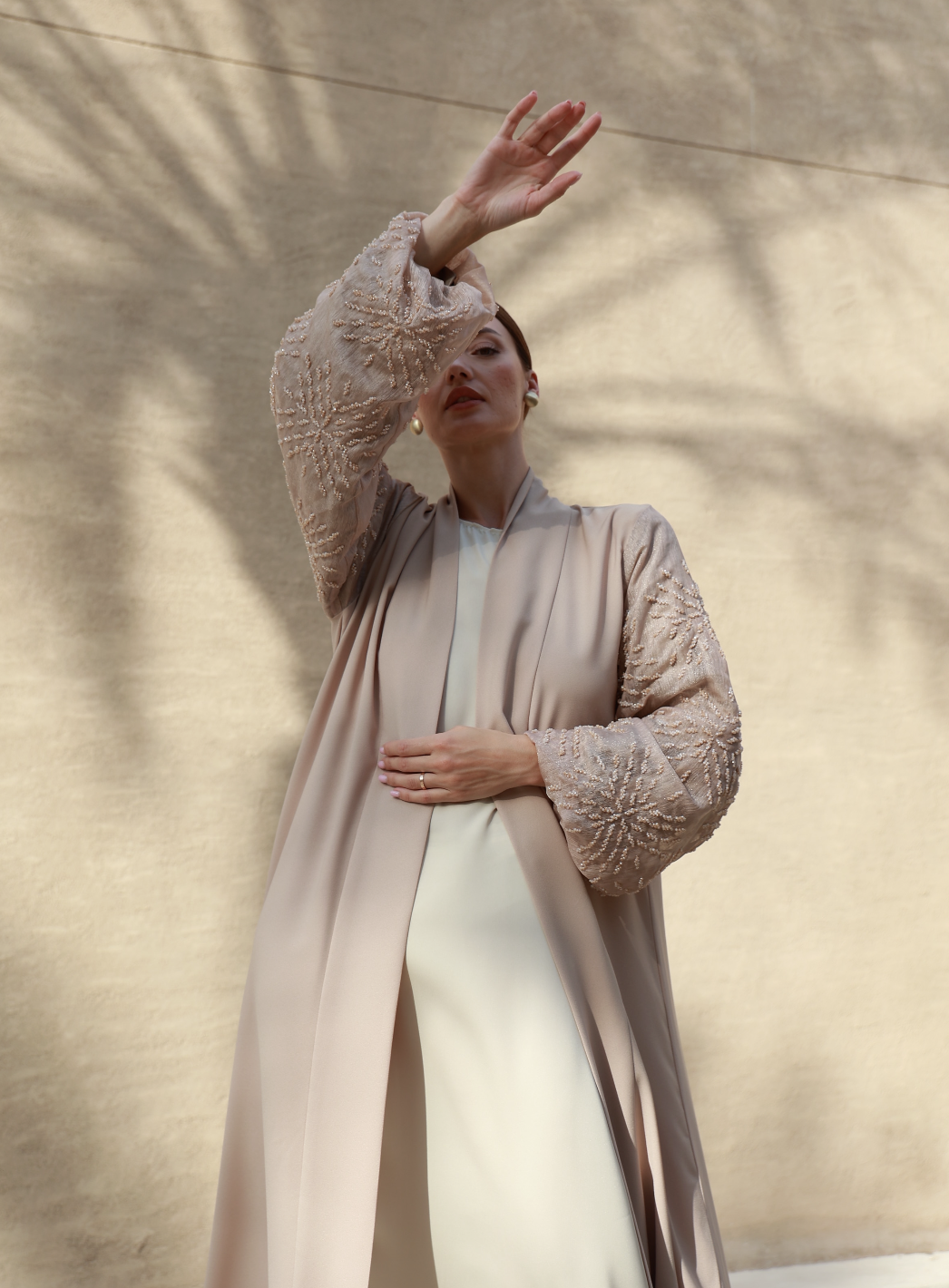 A considered capsule wardrobe laid out on linen